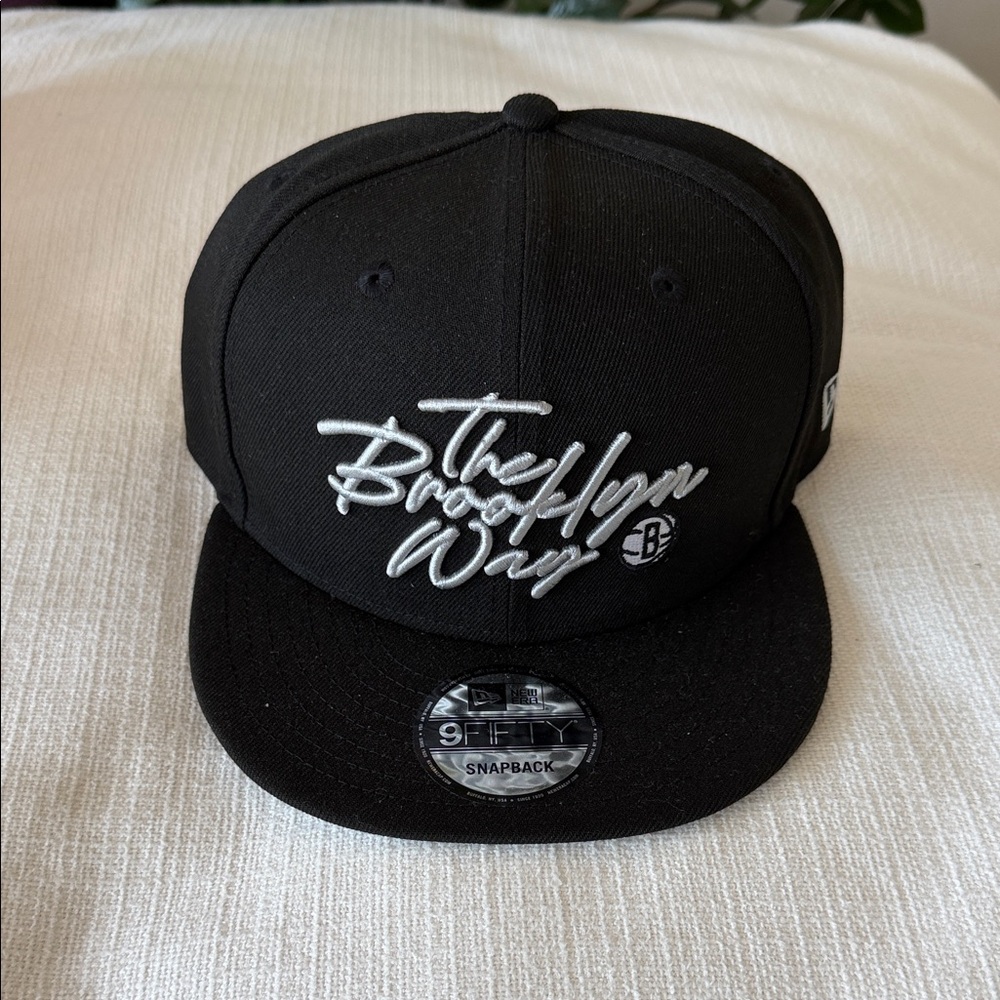 New Era Black Brooklyn Script Snapback Hat with White Embroidery